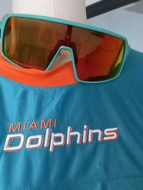 Oakley Custom Sunglasses with Orange and Green Frame Dolphin Colors..